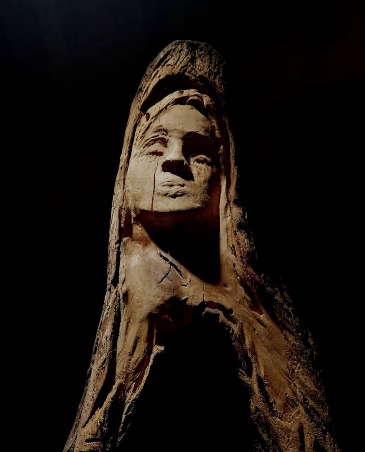 GAIA wood sculpture, close-up of the carved face